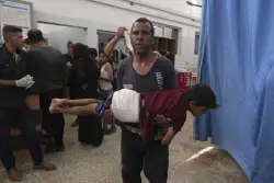 74 killed in Gaza as Israeli forces strike a cafe and fire on people seeking food